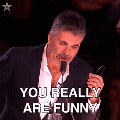 Man In Suit Holding Glasses Says You Really Are Funny GIF