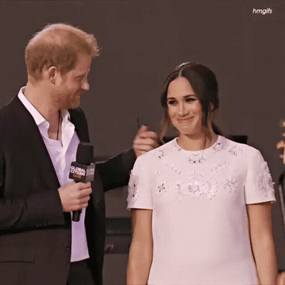 Man In Suit Holding Global Citizen Microphone GIF