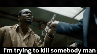 Man In Suit Holding Gun Says I'm Trying To Kill Somebody GIF