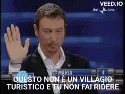 Man In Suit Holding Hand Up In Front Of Maria Sign GIF