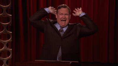 Man In Suit Holding Hands To Head GIF