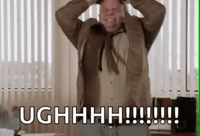 Man In Suit Holding Head And Screaming GIF