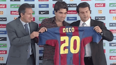 Man In Suit Holding Jersey Number 20 GIF