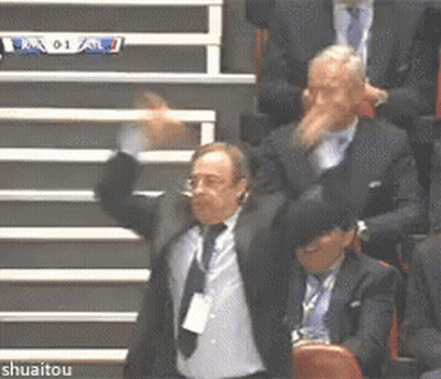 Man In Suit Holding Jersey Number 20 GIF