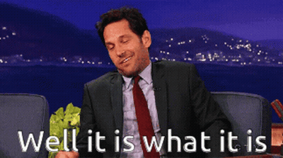 Man In Suit Holding Lettuce Saying Well It Is What It Is GIF