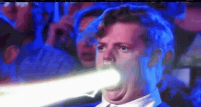Man In Suit Holding Light Beam In Mouth GIF