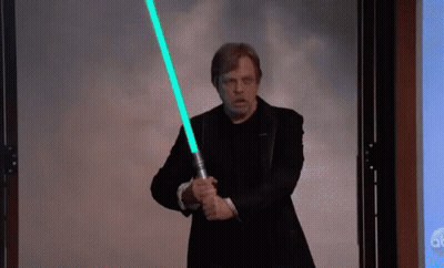 Man In Suit Holding Light Saber GIF