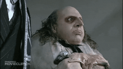 Man In Suit Holding Meat With Fandango Clip GIF