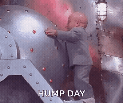Man In Suit Holding Metal Object GIF