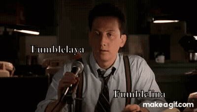 Man In Suit Holding Microphone GIF