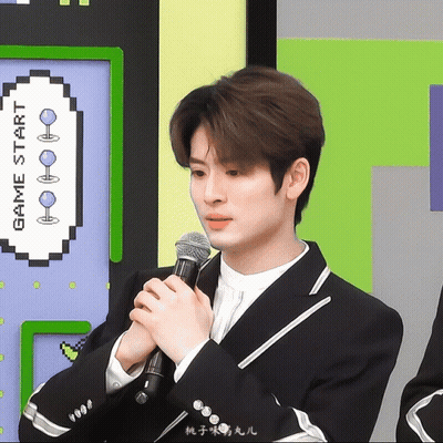 Man In Suit Holding Microphone At Game Start Sign GIF