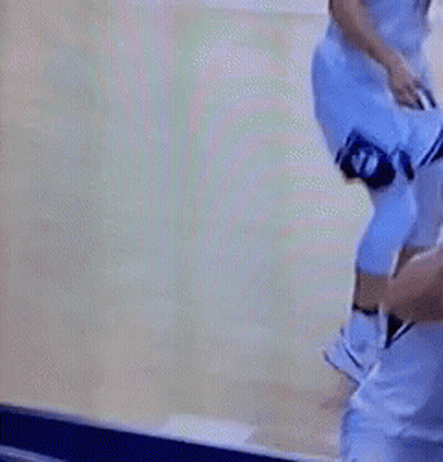 Man In Suit Holding Microphone Blue Wall NBA GIF