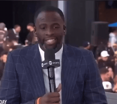 Man In Suit Holding Microphone GIF
