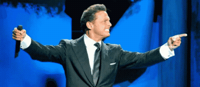 Man In Suit Holding Microphone Pointing GIF