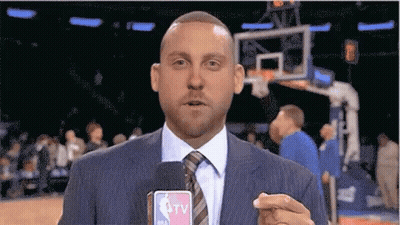 Man In Suit Holding Microphone GIF