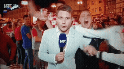 Man In Suit Holding Microphone Saying HR GIF