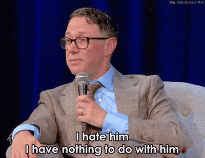 Man In Suit Holding Microphone Saying I Hate Him I Have Nothing To Do With Him GIF
