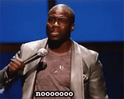 Man In Suit Holding Microphone Saying Nooo GIF