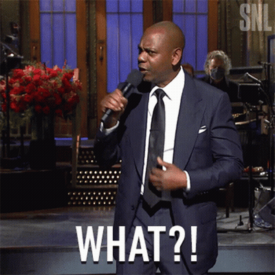 Man In Suit Holding Microphone Saying What GIF