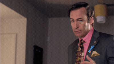 Man In Suit Holding Microphone Talking GIF