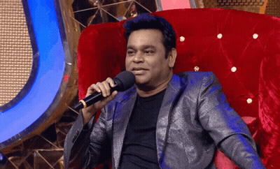 Man In Suit Holding Microphone GIF