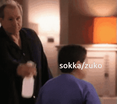 Man In Suit Holding Milk Bottle GIF