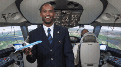 Man In Suit Holding Model Airplane GIF