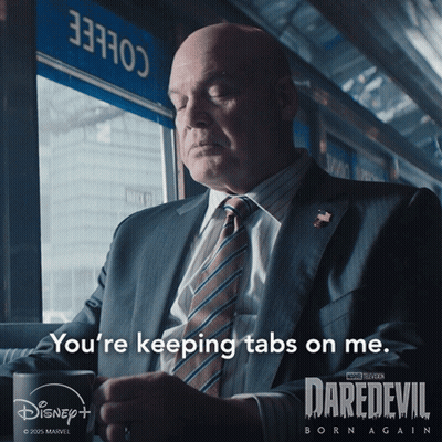 Man In Suit Holding Mug Says Keeping Tabs GIF