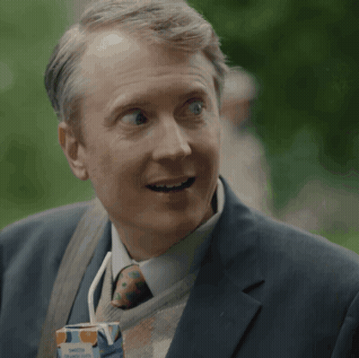 Man In Suit Holding Orange Juice GIF