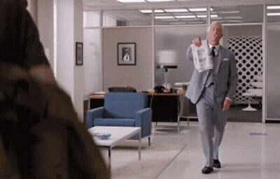 Man In Suit Holding Paper GIF