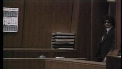 Man In Suit Holding Paper GIF