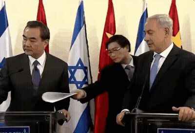 Man In Suit Holding Paper GIF