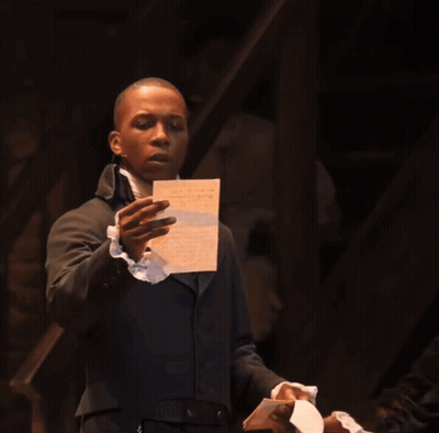 Man In Suit Holding Paper GIF