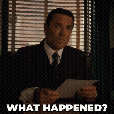 Man In Suit Holding Paper Saying What GIF