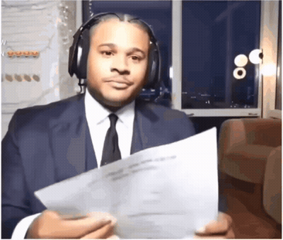 Man In Suit Holding Paper GIF