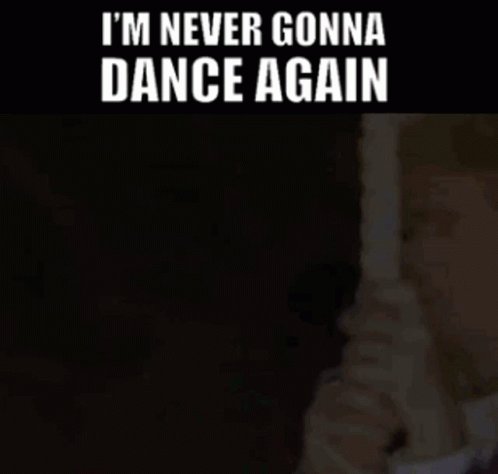 Man In Suit Holding Paper With I'm Never Gonna Dance Again GIF