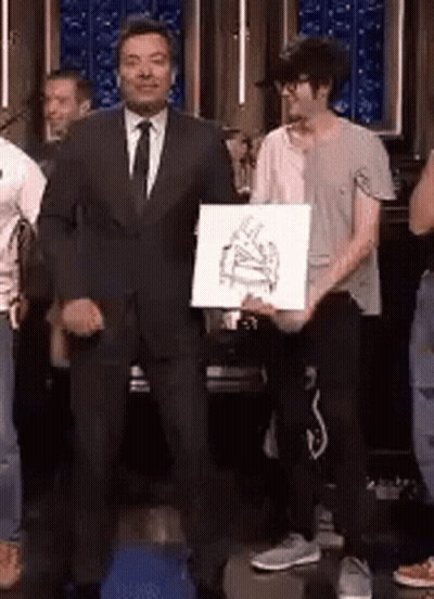 Man In Suit Holding Paper With Piano Picture GIF