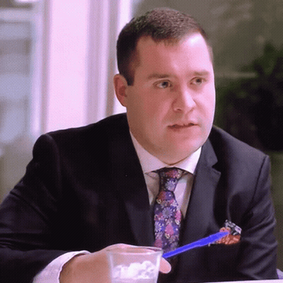 Man in Suit Holding Pen in Pocket