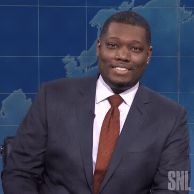 Man In Suit Holding Pencil Smiling GIF