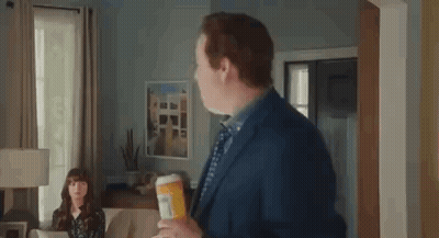 Man In Suit Holding Pills GIF