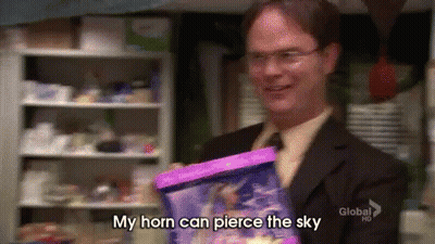 Man In Suit Holding Pink Bag Saying My Horn Can Pierce The Sky GIF