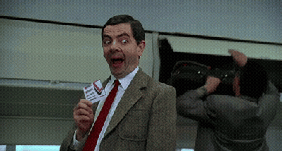 Man In Suit Holding Plane Ticket GIF
