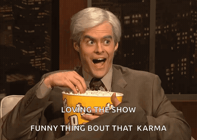 Man In Suit Holding Popcorn Says Loving The Show Funny Thing Bout That Karma GIF