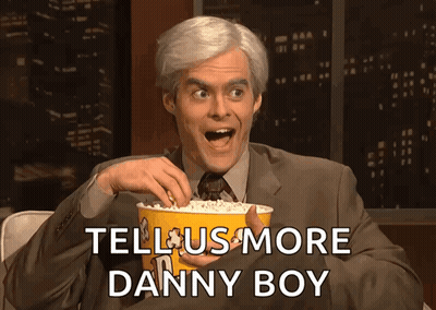 Man In Suit Holding Popcorn Tell Us More Danny Boy GIF