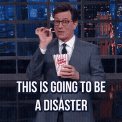 Man In Suit Holding Popcorn This Is Disaster GIF