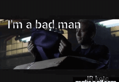 Man In Suit Holding Purple Bag Saying I'm A Bad Man GIF