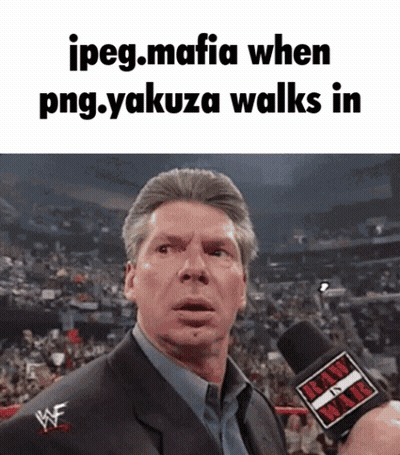 Man In Suit Holding Raw Microphone GIF