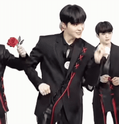 Man In Suit Holding Red Rose GIF