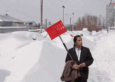 Man In Suit Holding Red Shovel GIF