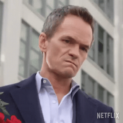 Man In Suit Holding Rose GIF